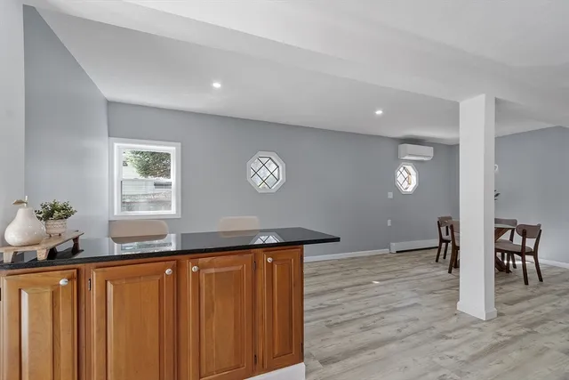 a view of a kitchen counter space and wooden floor