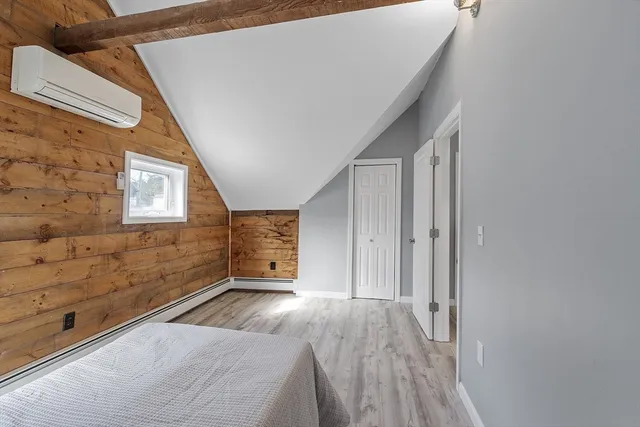 a view of an empty room and a window