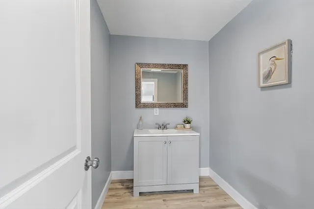 a bathroom with a sink and a mirror