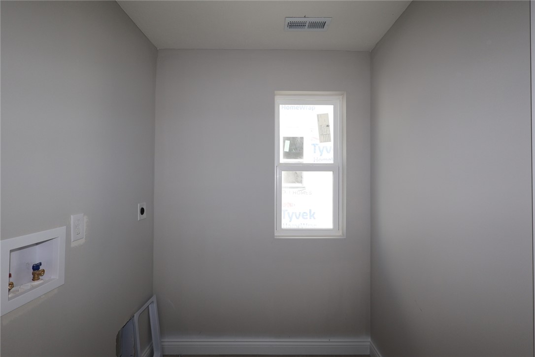 230 Tilly Court, Unit 4 Springboro, OH 45066 - Photo 16 of 20 This spacious laundry area offers practical hookups and a window for natural light.