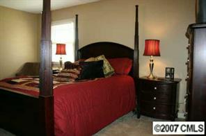 4083 Lake Shore Road South Denver, NC 28037 - Photo 8 of 8 a bedroom with a bed and a closet