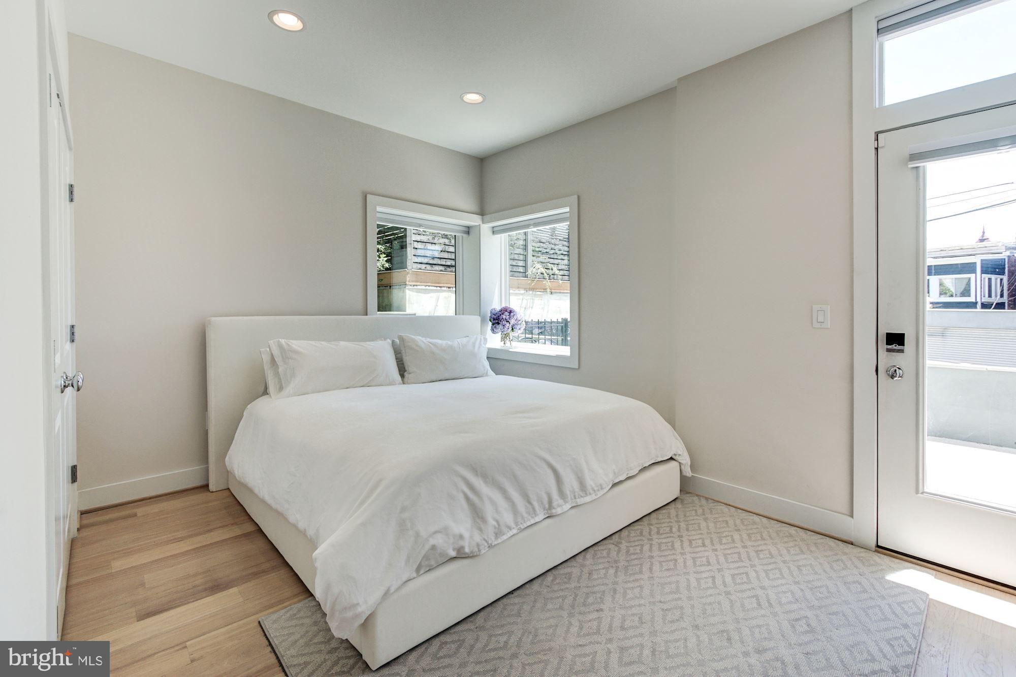 1352 Quincy Street Northwest, Unit 1 Washington, DC 20011 - Photo 15 of 26 a bedroom with a bed and windows