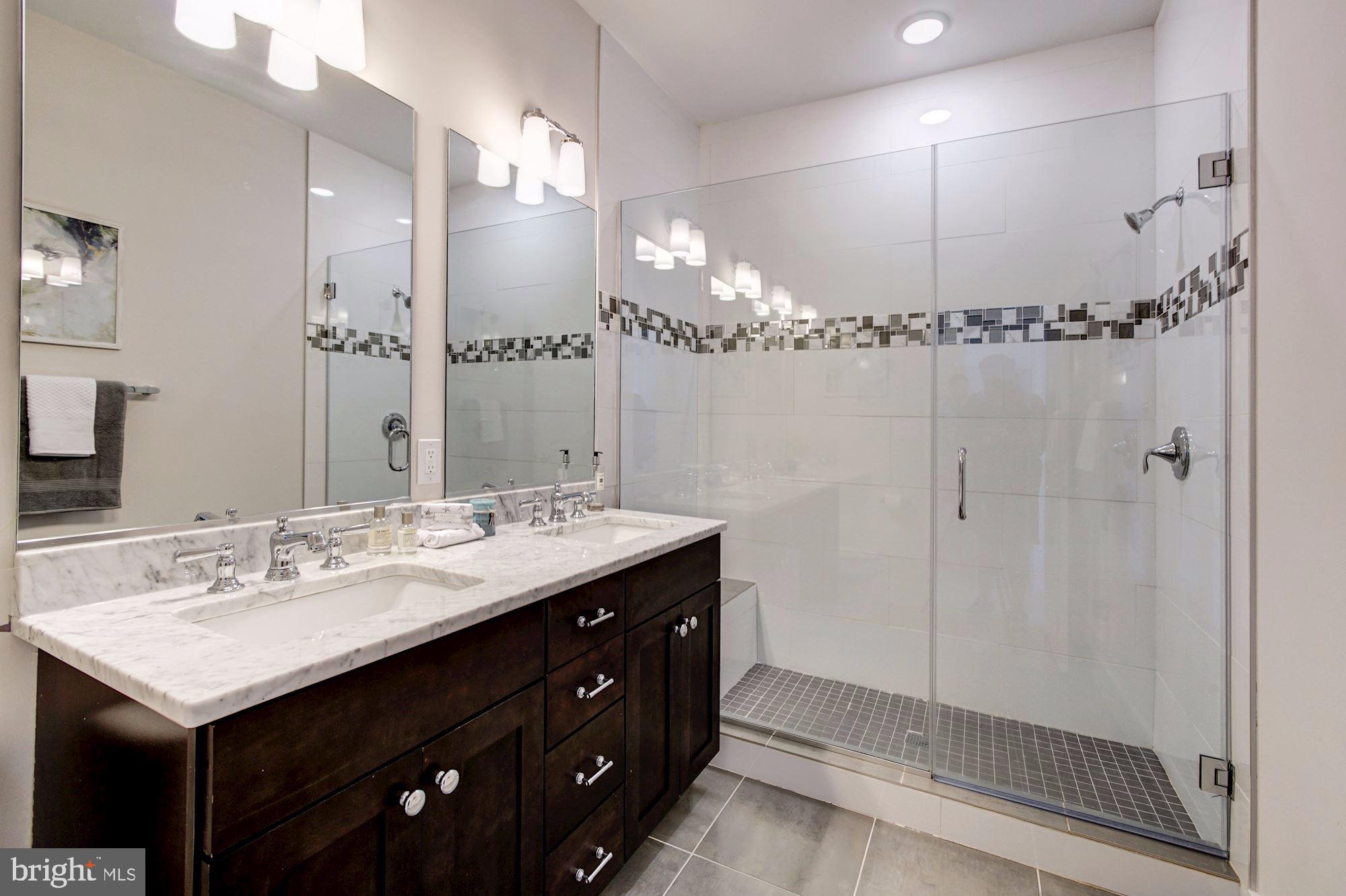 1352 Quincy Street Northwest, Unit 1 Washington, DC 20011 - Photo 17 of 26 a bathroom with a sink double vanity and a mirror