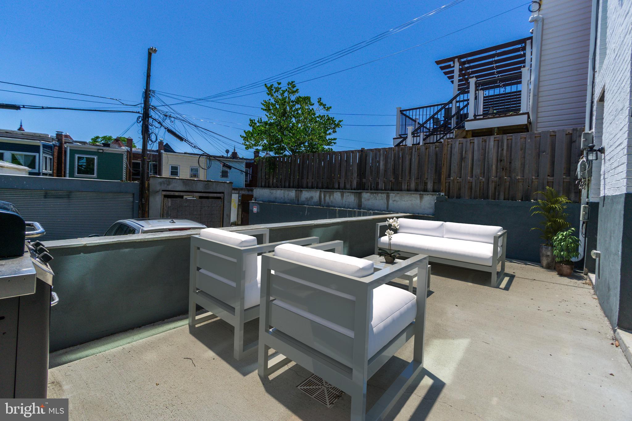1352 Quincy Street Northwest, Unit 1 Washington, DC 20011 - Photo 21 of 26 a view of a patio with a table and chairs