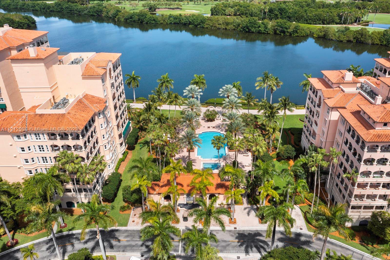 13631 Deering Bay Drive, Unit 237 Coral Gables, FL 33158 - Photo 1 of 54 an aerial view of a house with a lake view