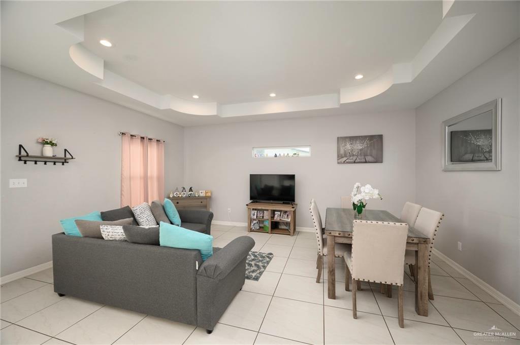 473 Pera Avenue Brownsville, TX 78521 - Photo 3 of 17 a living room with furniture a flat screen tv and a window