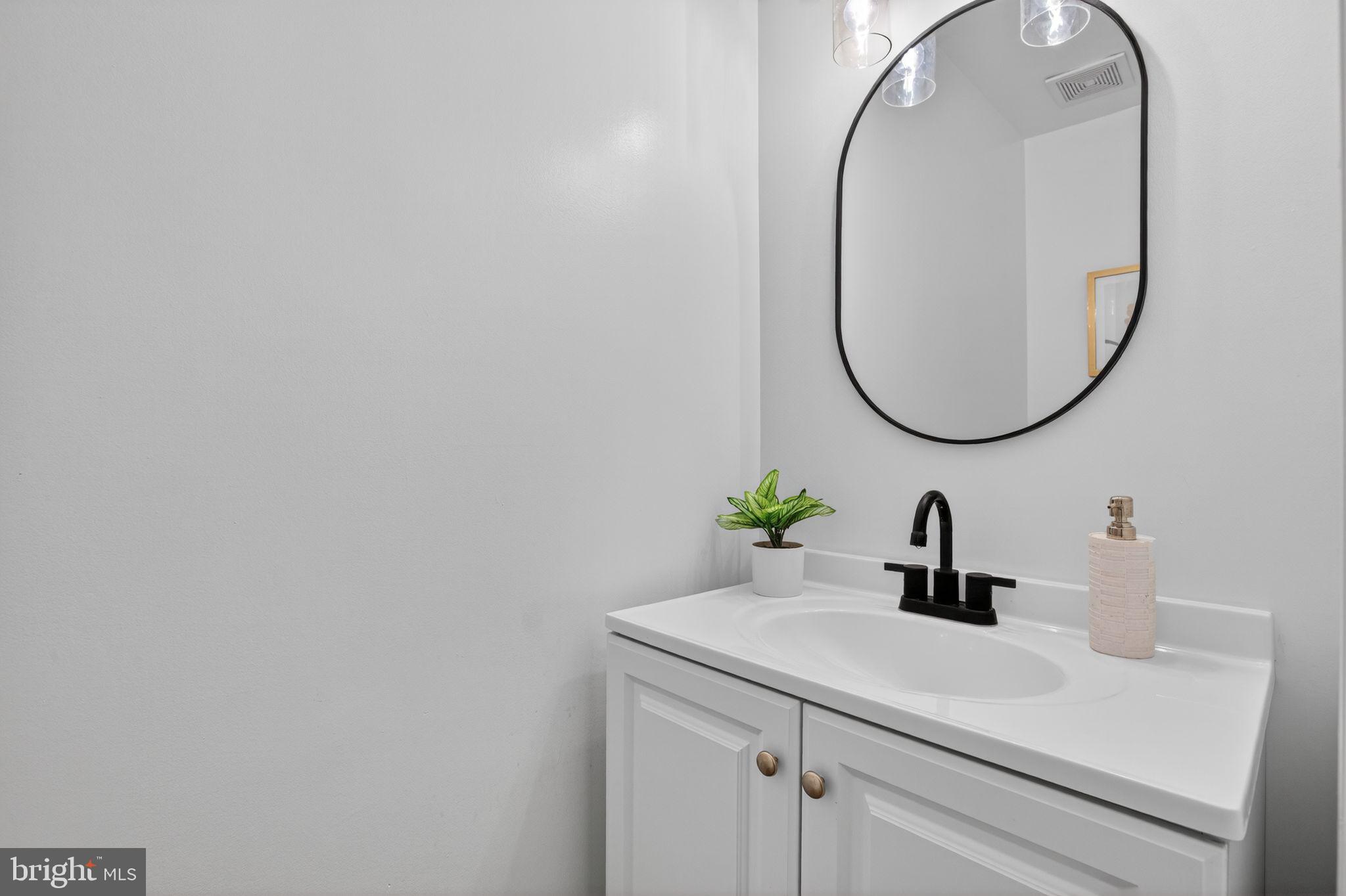 3278 Ryon Court Waldorf, MD 20601 - Photo 17 of 29 a bathroom with a sink and a mirror