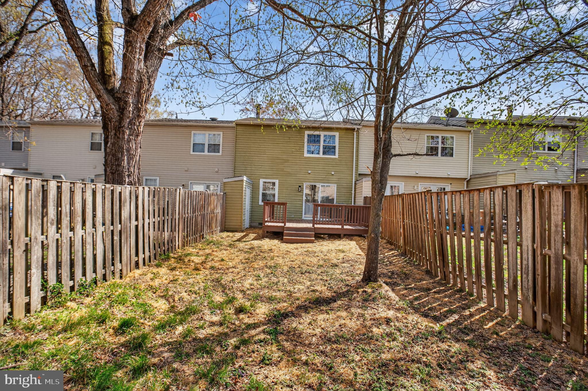 3278 Ryon Court Waldorf, MD 20601 - Photo 27 of 29 a view of a house with wooden fence next to a large tree