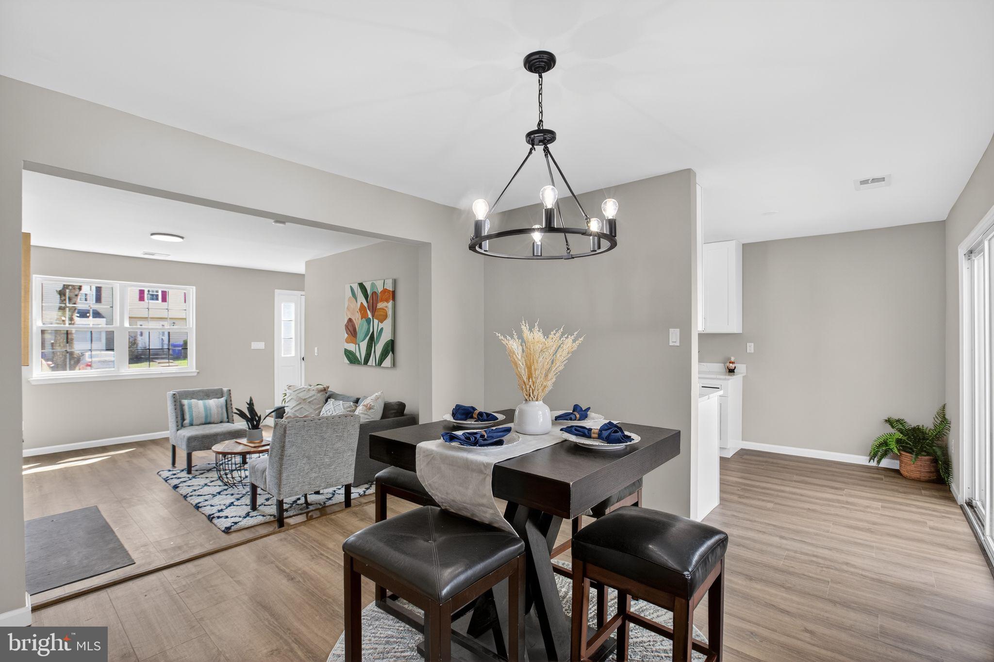 3278 Ryon Court Waldorf, MD 20601 - Photo 6 of 29 a view of a dining room with furniture wooden floor and chandelier