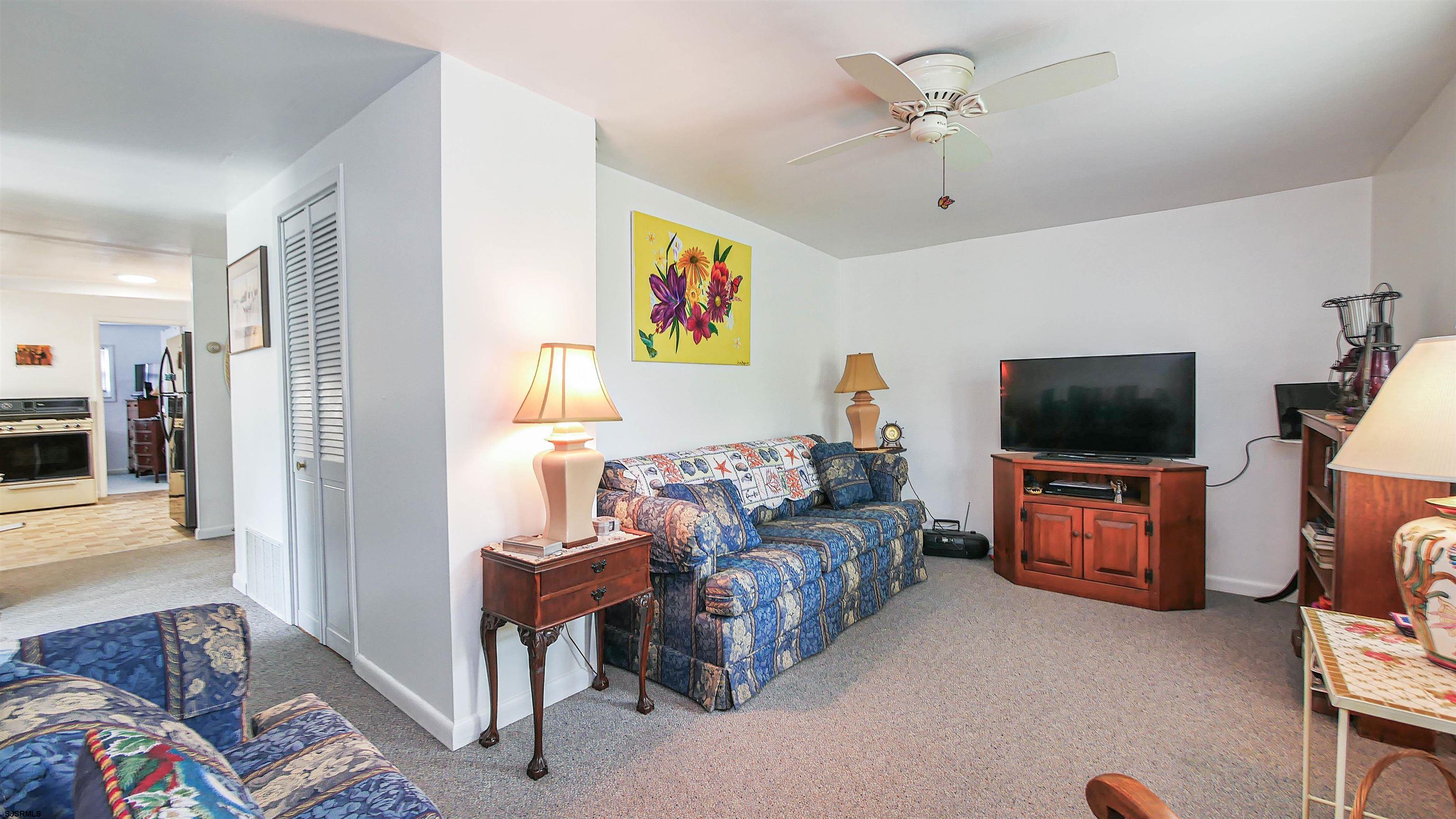 605 1st Street Somers Point, NJ 08244 - Photo 17 of 33 a living room with furniture and a flat screen tv