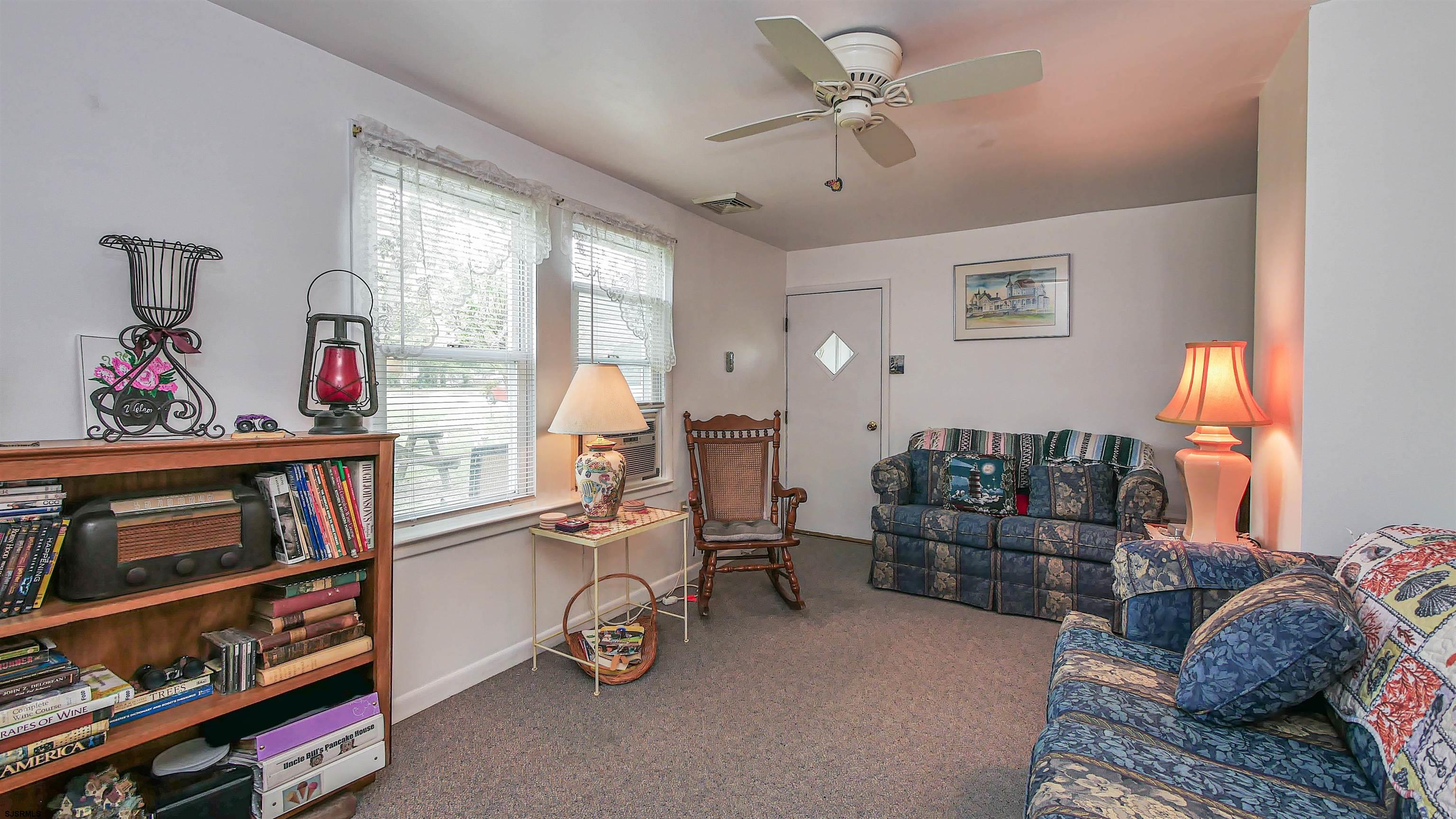 605 1st Street Somers Point, NJ 08244 - Photo 19 of 33 a bedroom with furniture a rug and a window
