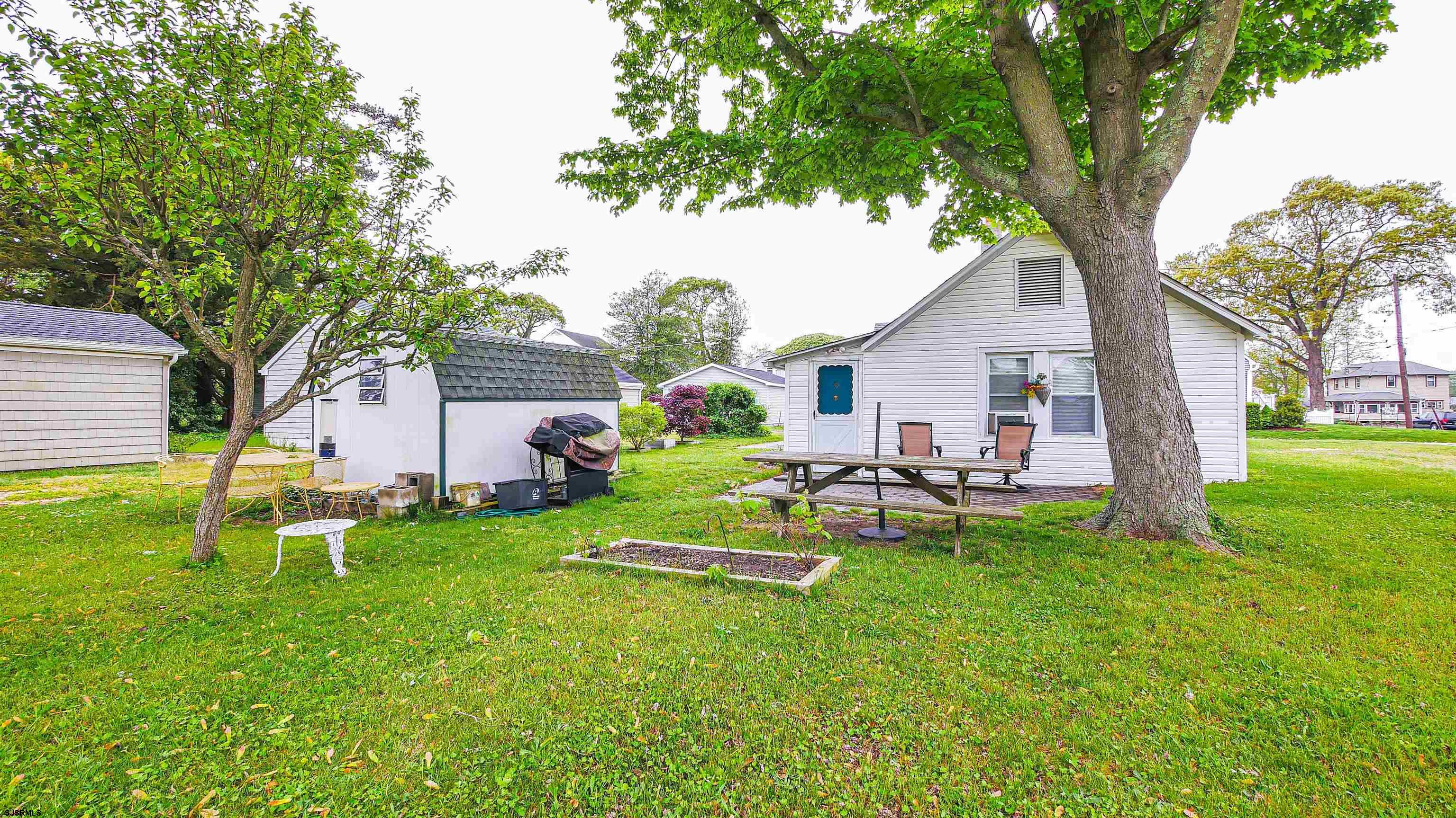 605 1st Street Somers Point, NJ 08244 - Photo 2 of 33 a view of a house with a yard porch and sitting area
