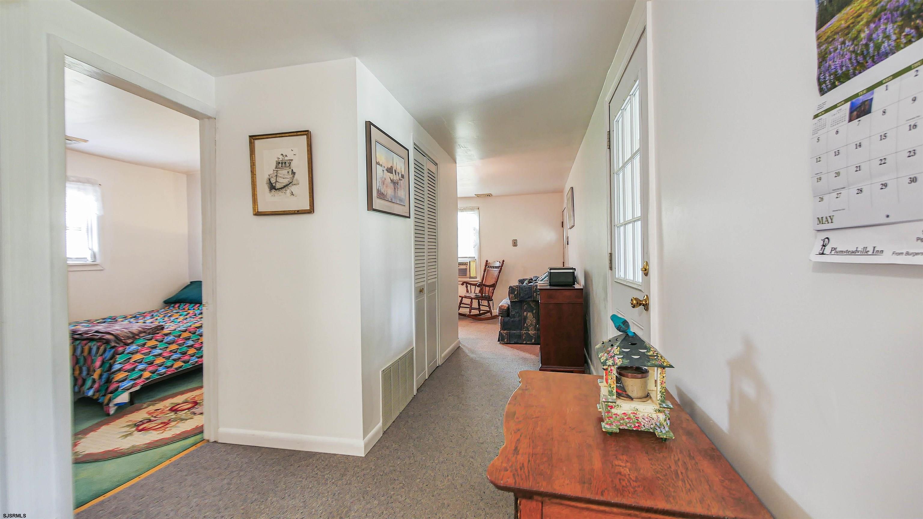 605 1st Street Somers Point, NJ 08244 - Photo 21 of 33 a view of a bedroom with bed and workspace