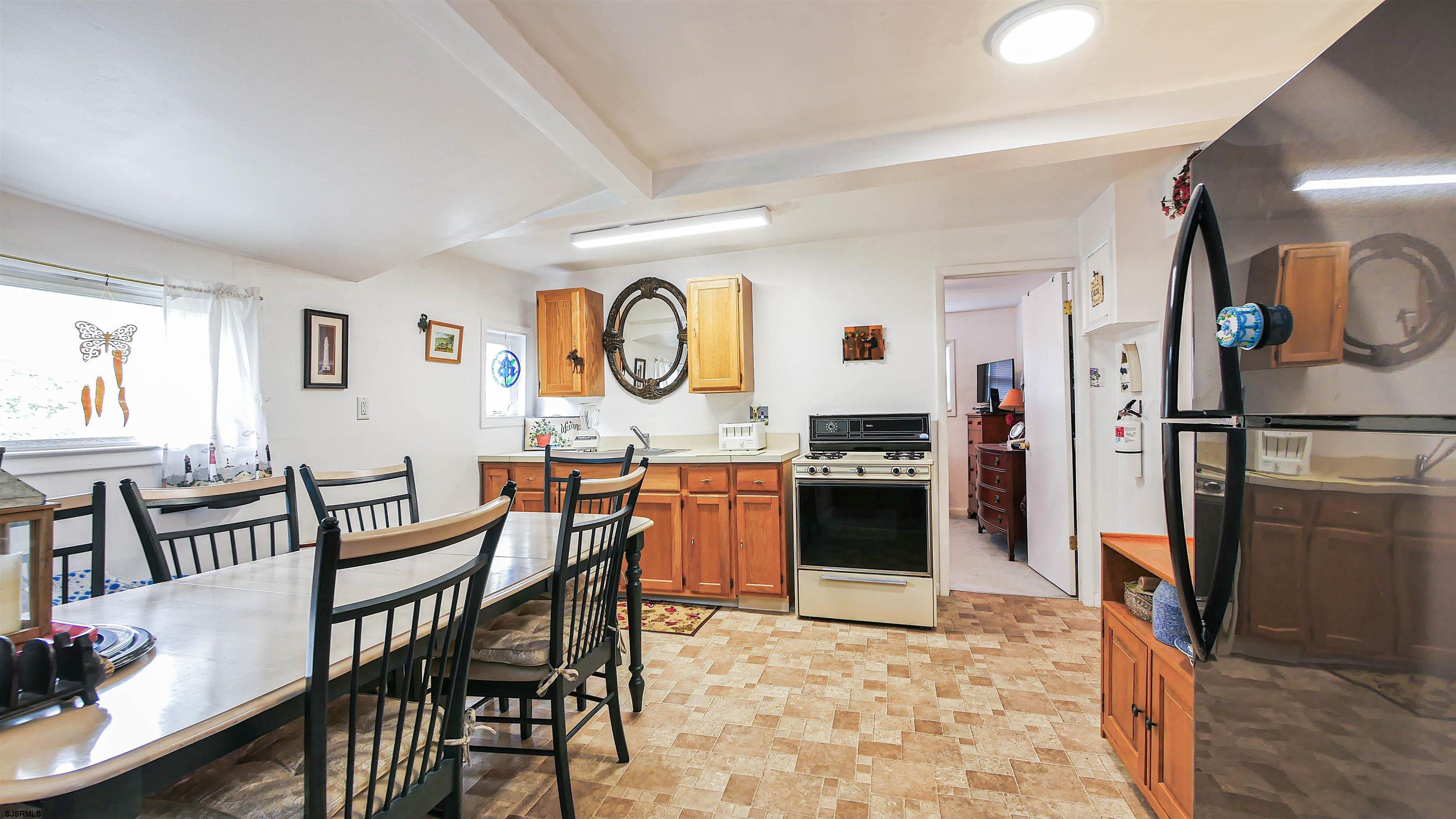 605 1st Street Somers Point, NJ 08244 - Photo 22 of 33 a view of a kitchen and dining room