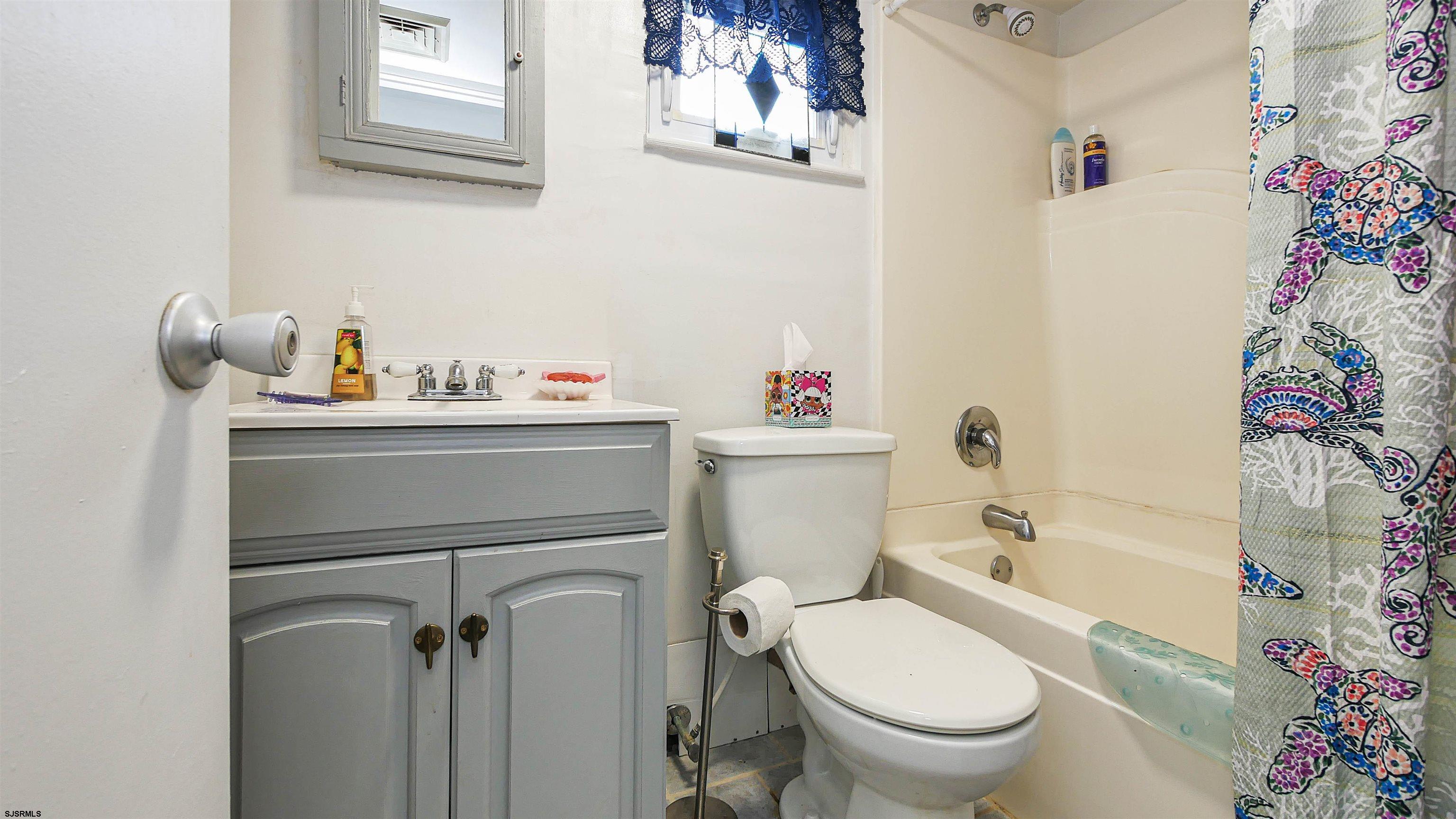 605 1st Street Somers Point, NJ 08244 - Photo 26 of 33 a bathroom with a sink toilet and shower
