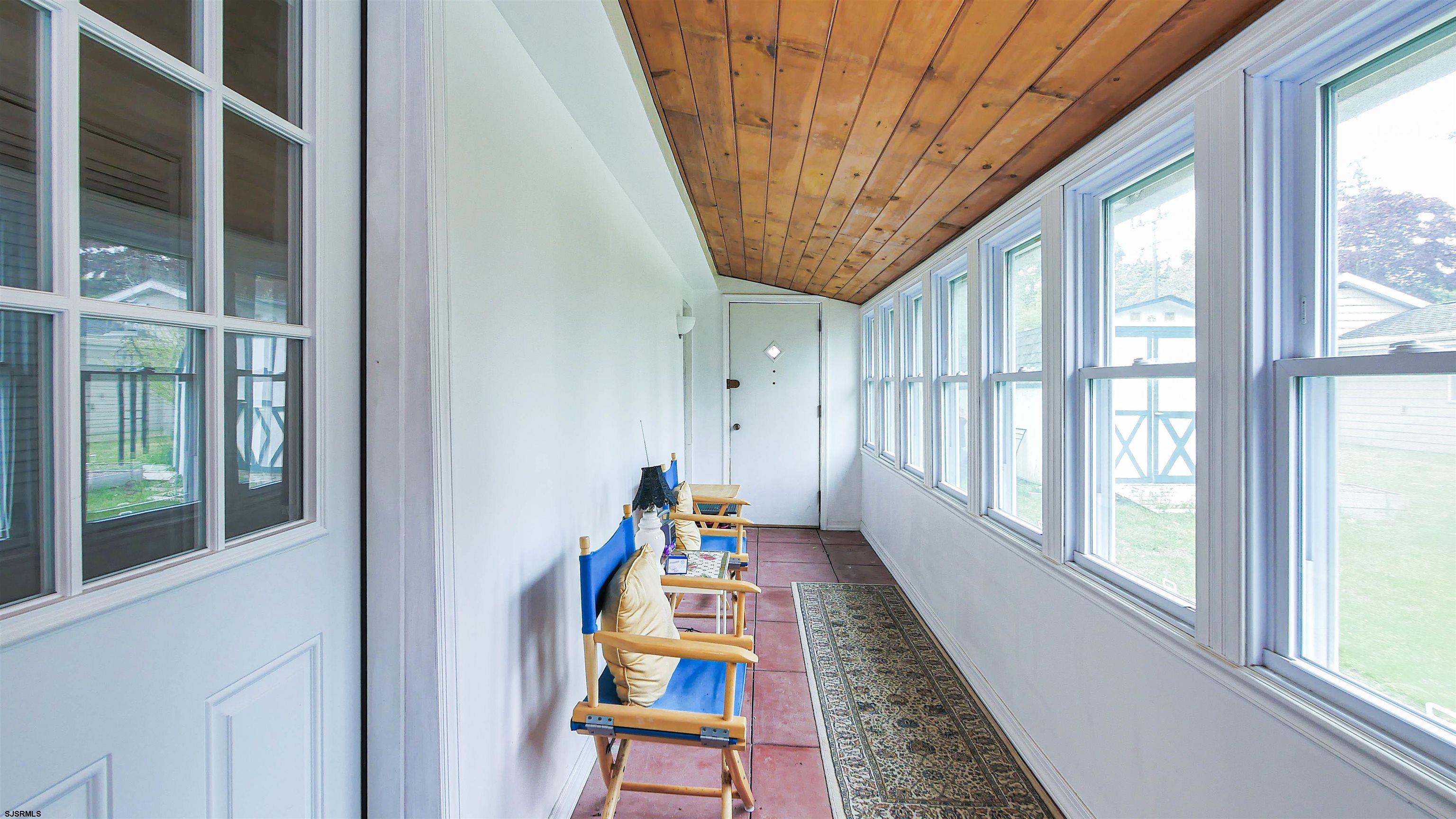 605 1st Street Somers Point, NJ 08244 - Photo 33 of 33 a bed room with furniture and a large window