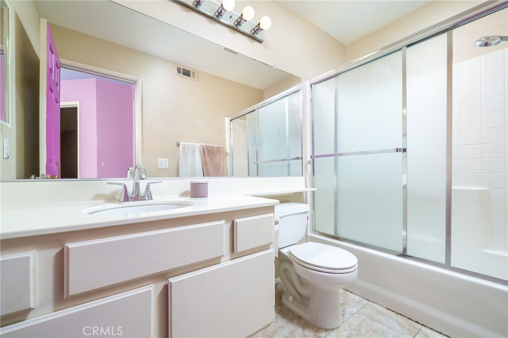 3707 Calle Curacso Riverside, CA 92503 - Photo 17 of 43 a bathroom with a toilet a sink and a shower
