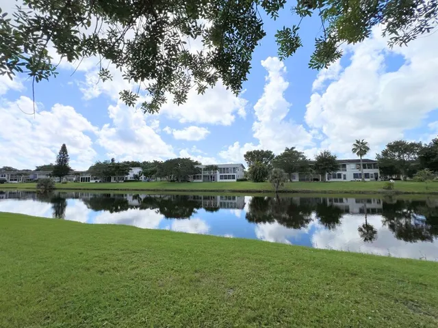 a view of swimming pool with seating space and deck