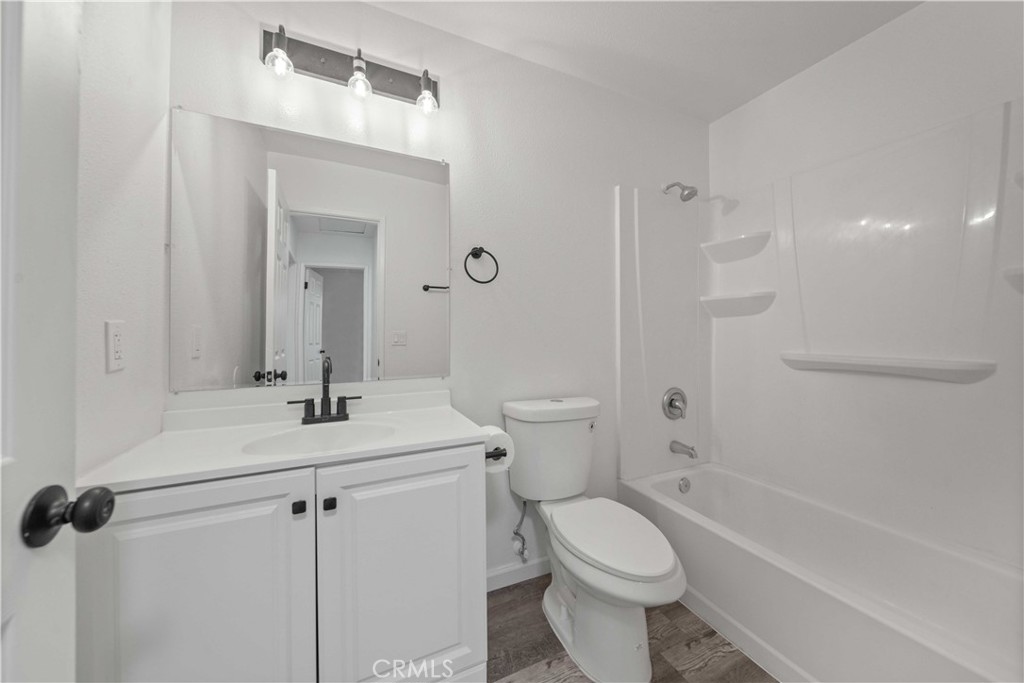 40054 Ridgemist Street Palmdale, CA 93591 - Photo 12 of 21 a bathroom with a sink a toilet and shower