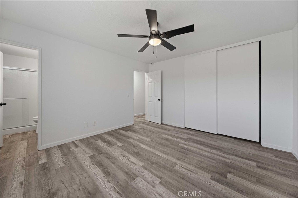 40054 Ridgemist Street Palmdale, CA 93591 - Photo 14 of 21 a view of empty room with wooden floor
