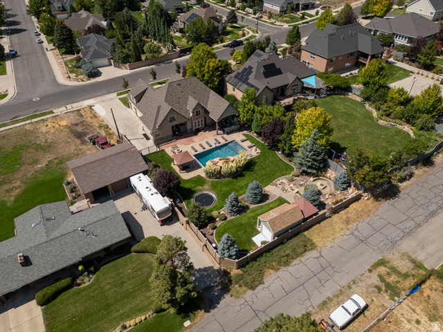 687 South 2080th Street East Springville, UT 84663 - Photo 78 of 149 Expansive property featuring a large in-ground swimming pool, a dedicated RV parking structure, and a secondary detached garage