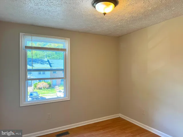 a view of room with window and closet