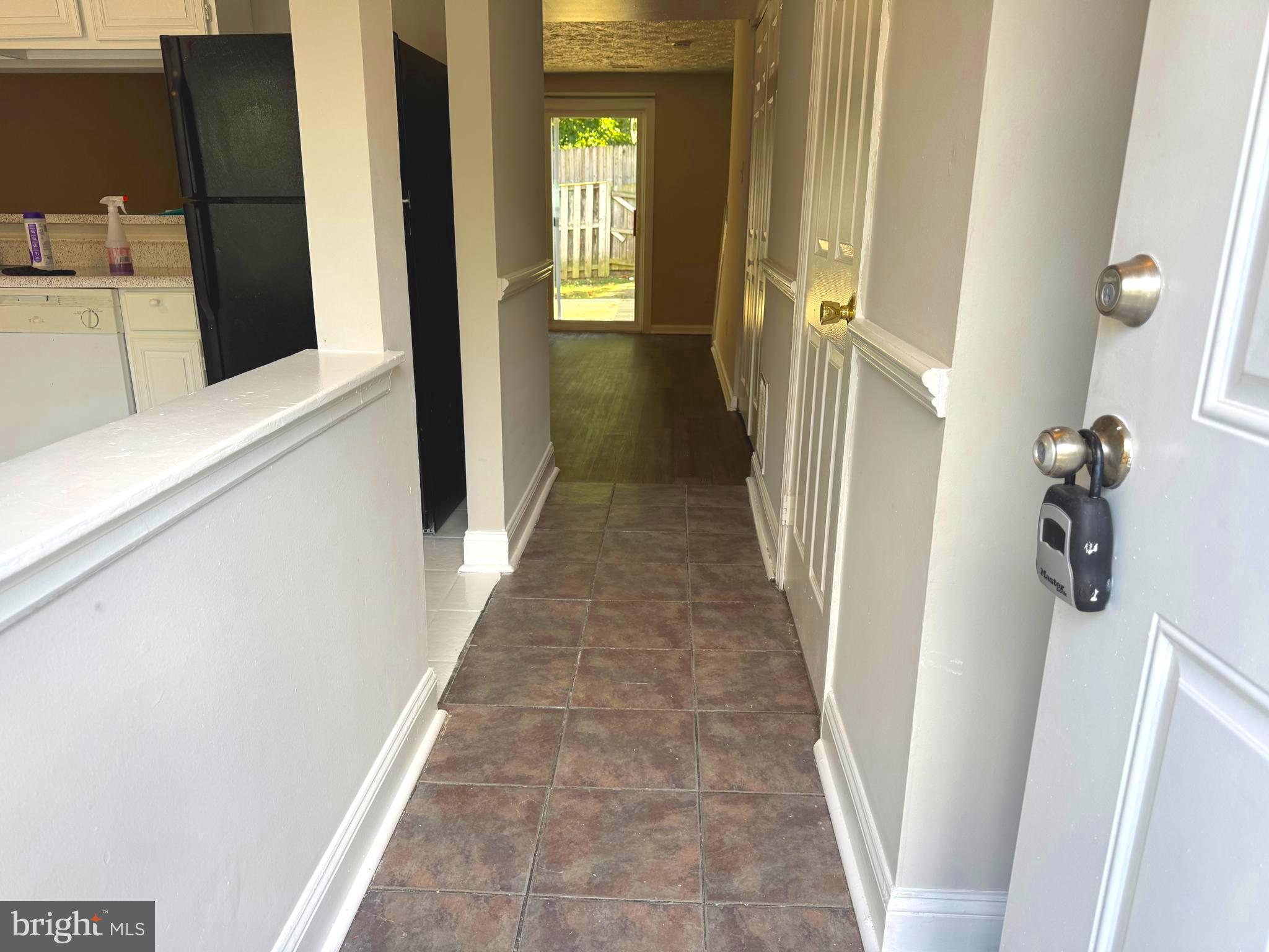 3615 Wharf Lane Triangle, VA 22172 - Photo 14 of 23 a view of a hallway with wooden floor and staircase