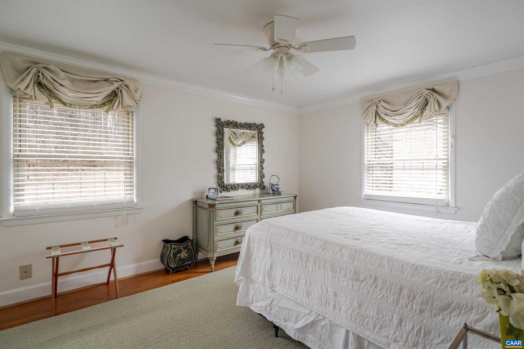 21 Deer Path Charlottesville, VA 22903 - Photo 19 of 27 a bedroom with a bed and a chandelier