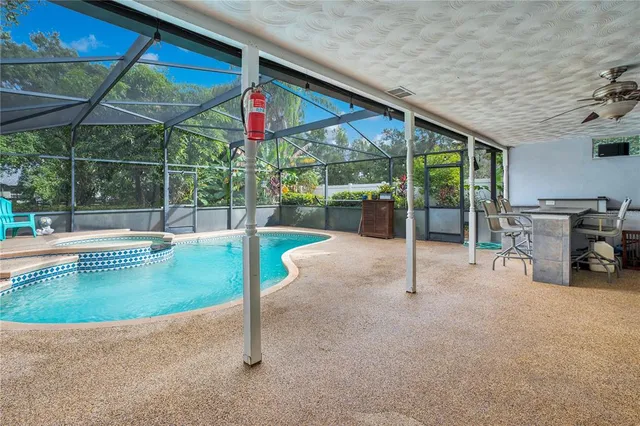 a view of a swimming pool with a patio