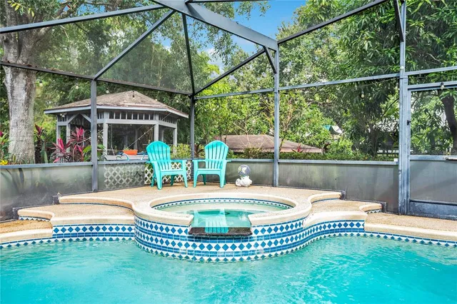 a view of a swimming pool with a patio