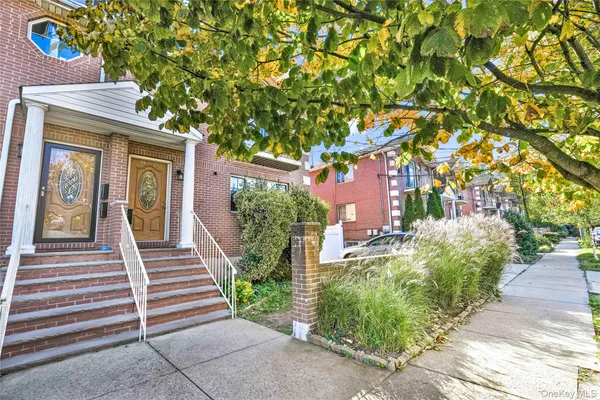a view of a house with brick walls