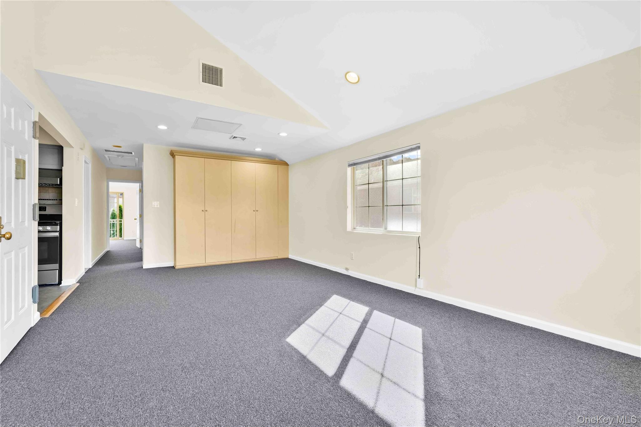 88-20 70th Road Queens, NY 11375 - Photo 15 of 31 an empty room with windows