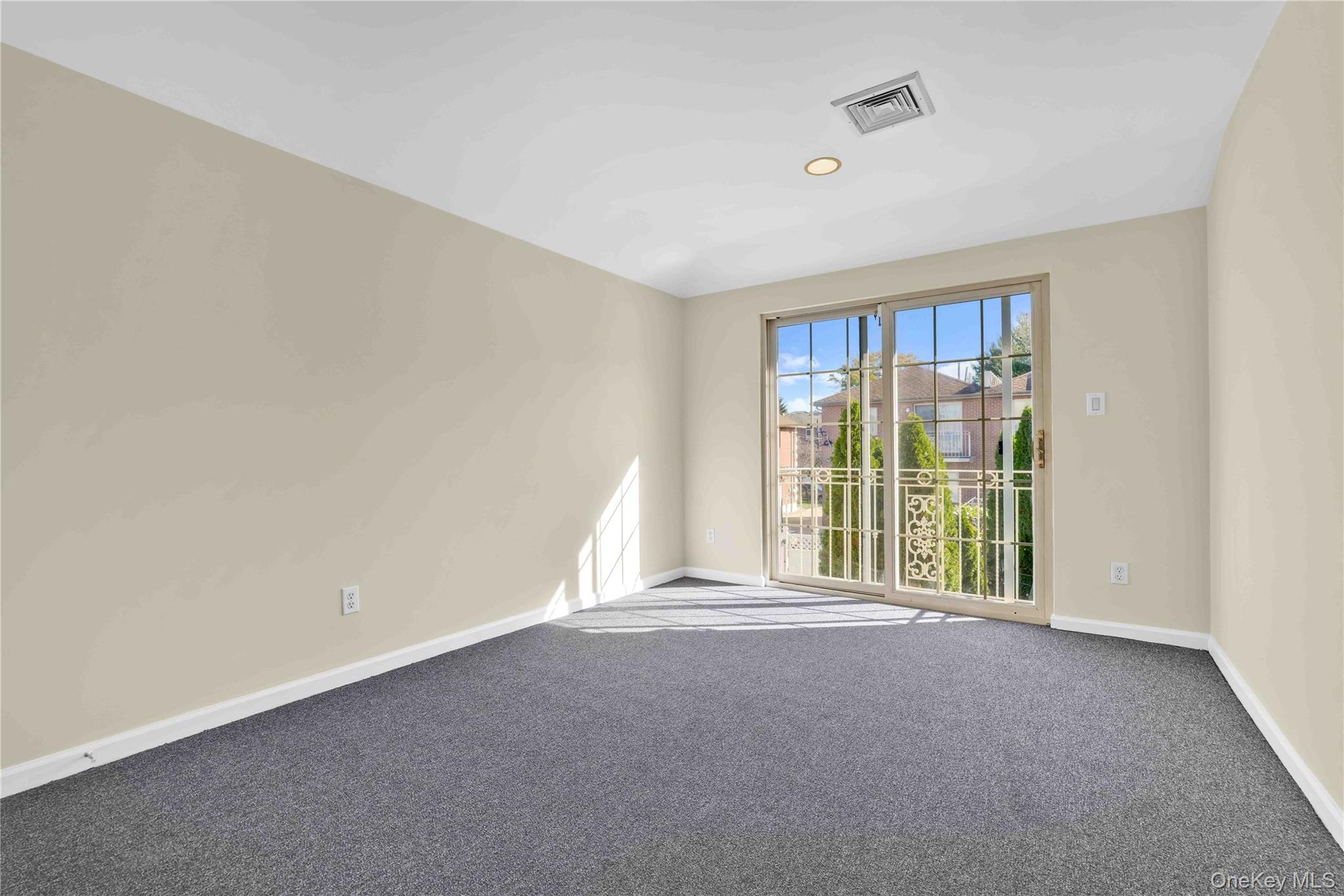 88-20 70th Road Queens, NY 11375 - Photo 18 of 30 a view of an empty room with a window