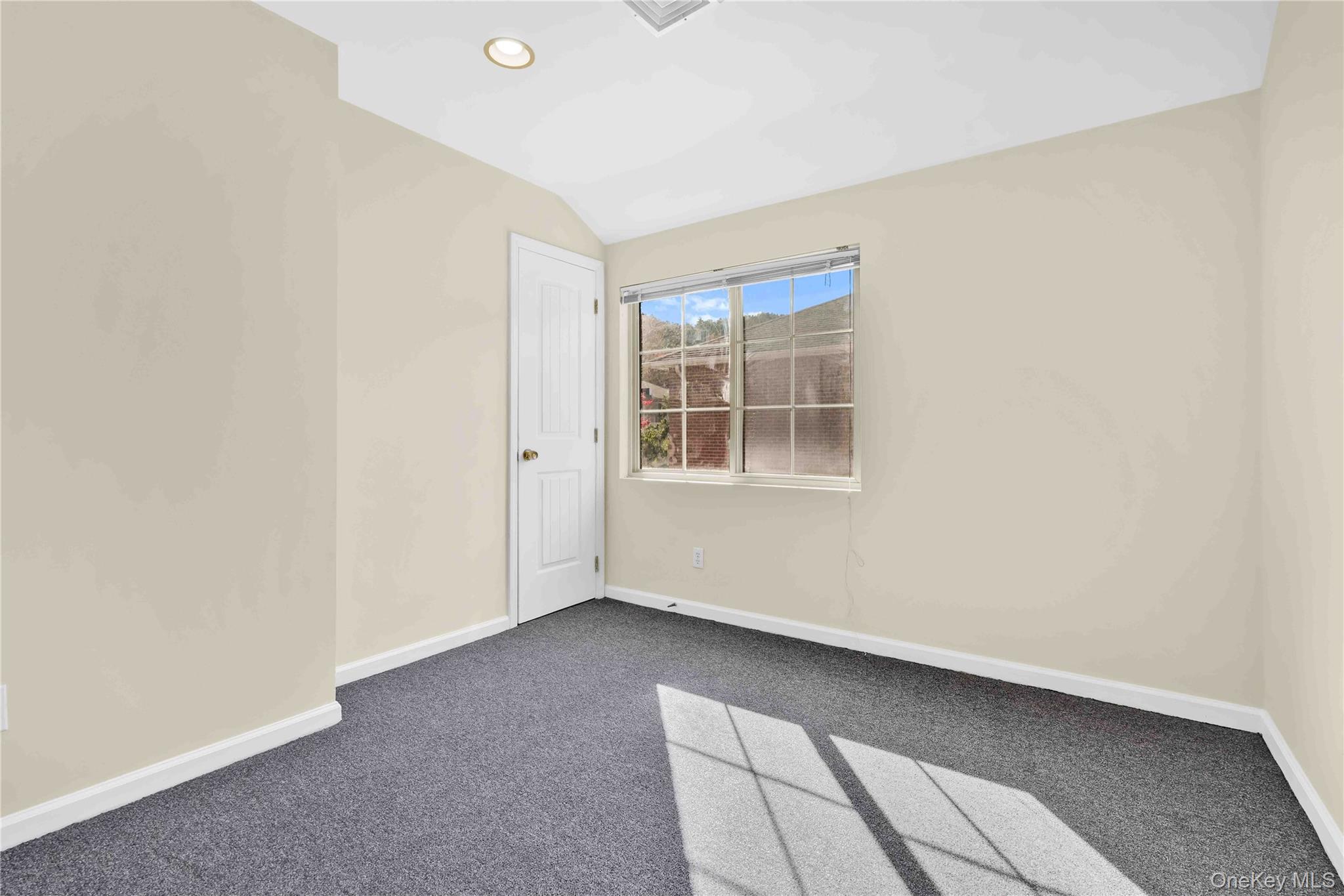 88-20 70th Road Queens, NY 11375 - Photo 25 of 31 a view of an empty room with a window