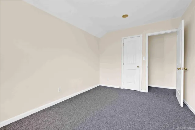 a bathroom with a granite countertop toilet a sink and a bathtub