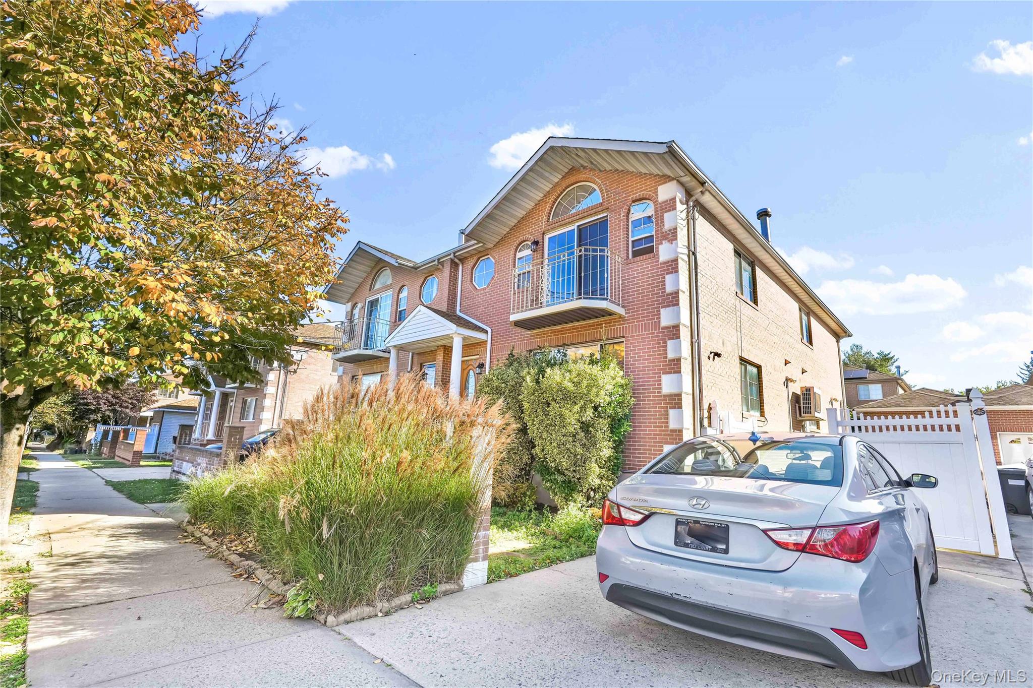 88-20 70th Road Queens, NY 11375 - Photo 3 of 30 a front view of a house with garden
