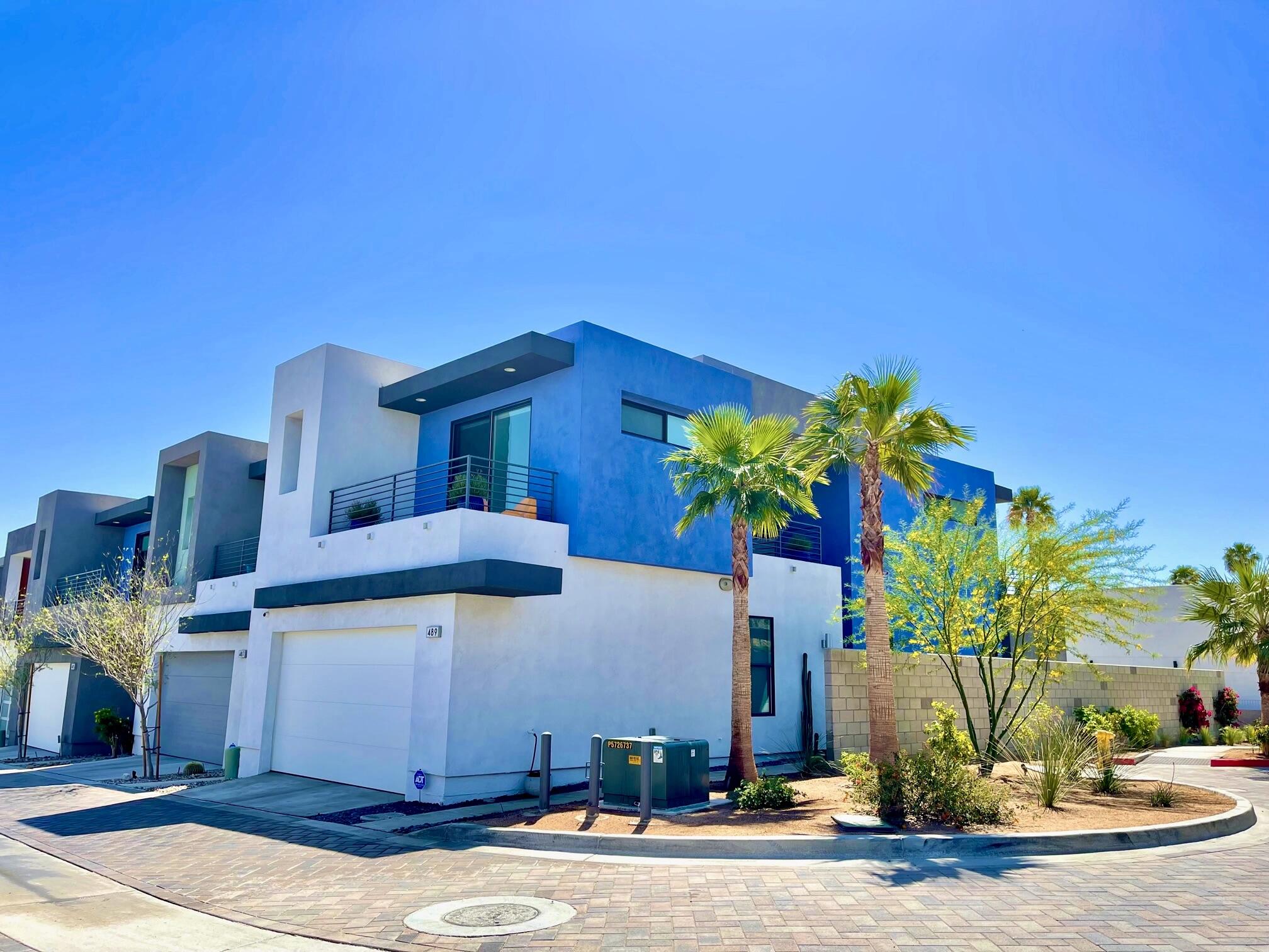 489 Beacon Way Palm Springs, CA 92262 - Photo 1 of 35 a front view of a house with a yard