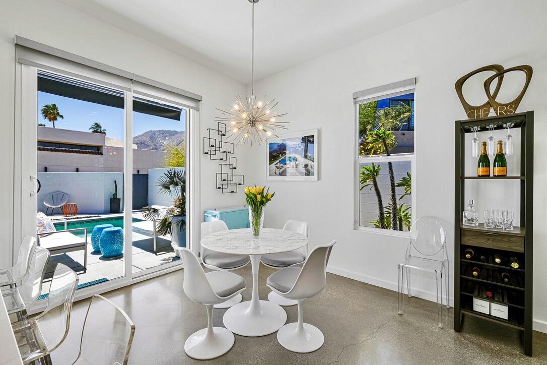 489 Beacon Way Palm Springs, CA 92262 - Photo 15 of 35 a view of a dining room with furniture and chandelier