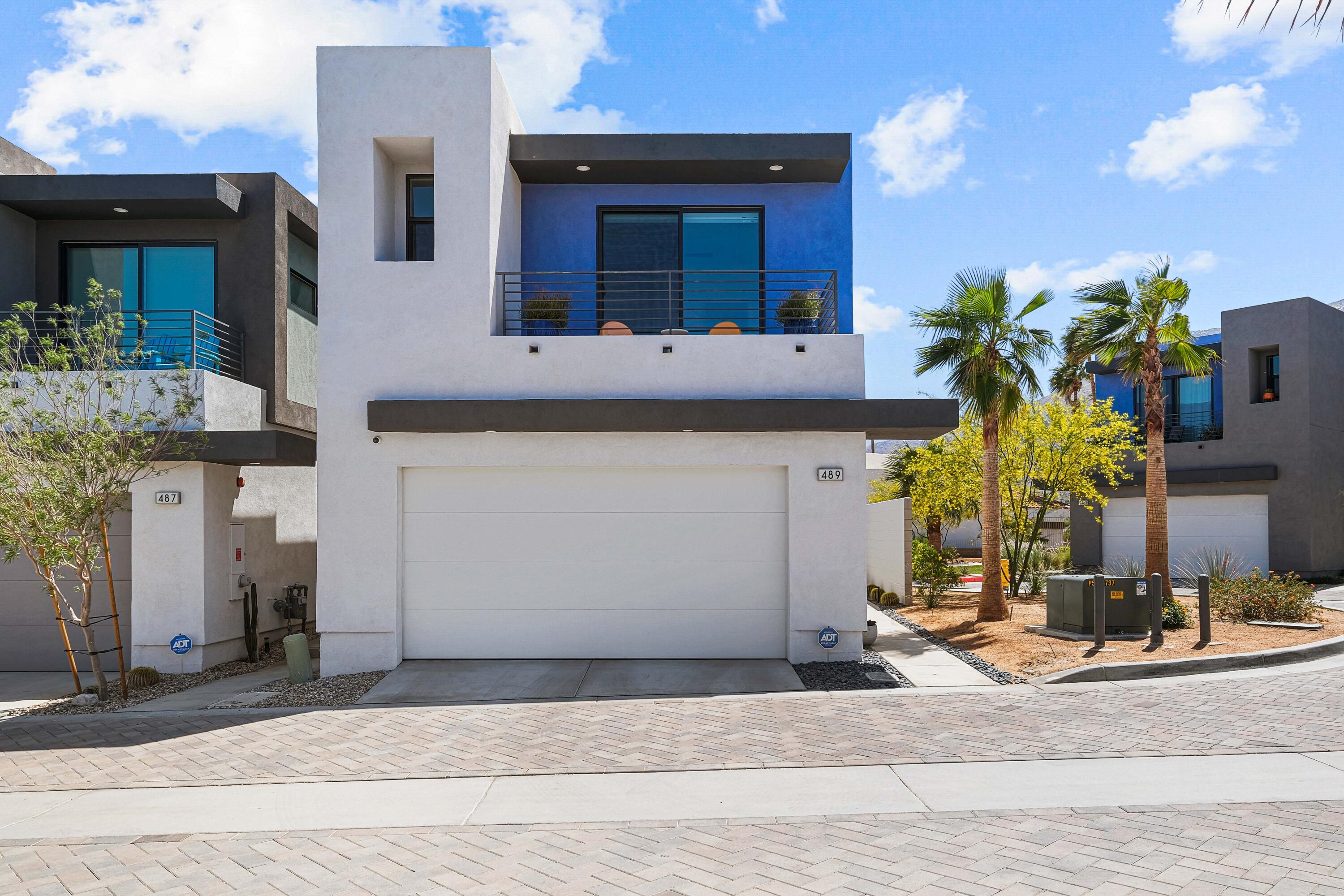 489 Beacon Way Palm Springs, CA 92262 - Photo 2 of 35 a front view of a house with a yard