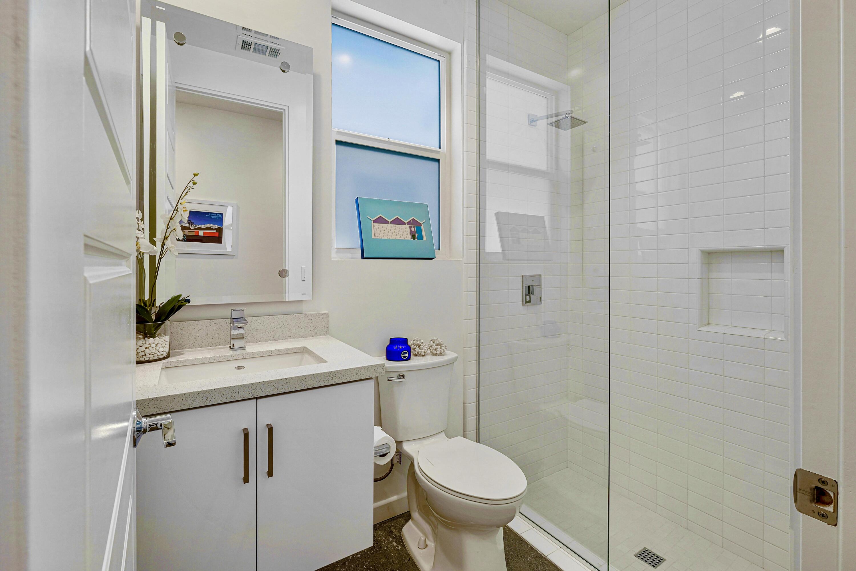 489 Beacon Way Palm Springs, CA 92262 - Photo 21 of 35 a bathroom with a sink toilet and shower