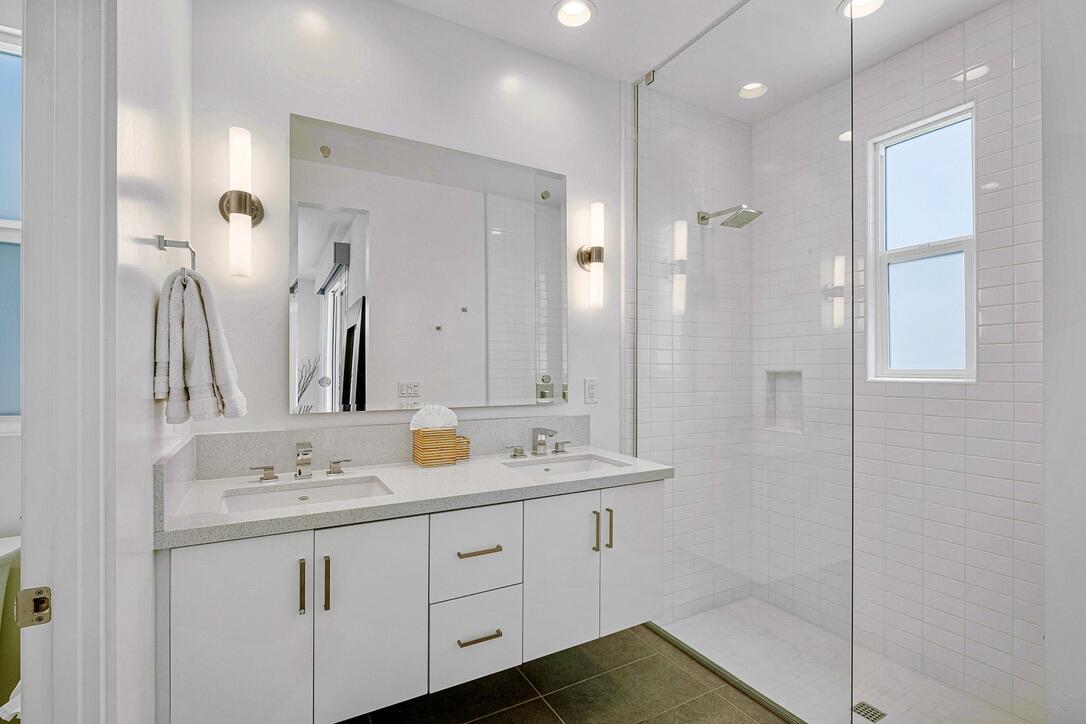 489 Beacon Way Palm Springs, CA 92262 - Photo 22 of 35 a bathroom with a double vanity sink mirror and shower