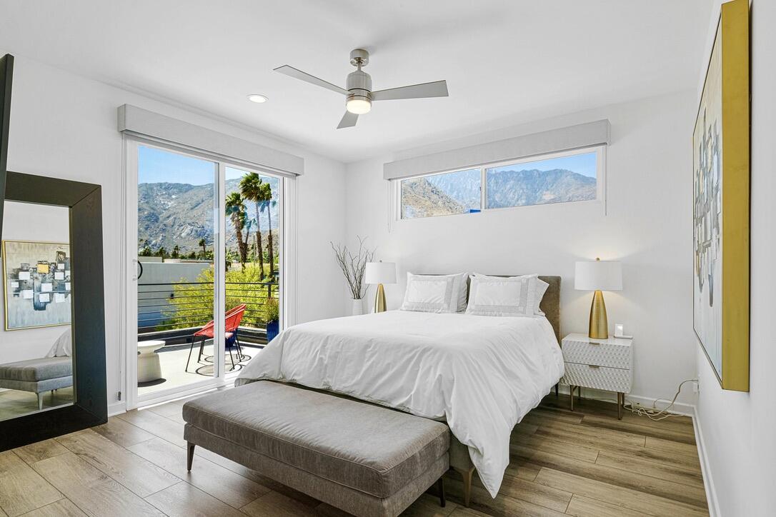 489 Beacon Way Palm Springs, CA 92262 - Photo 26 of 35 a bedroom with a bed and wooden floor