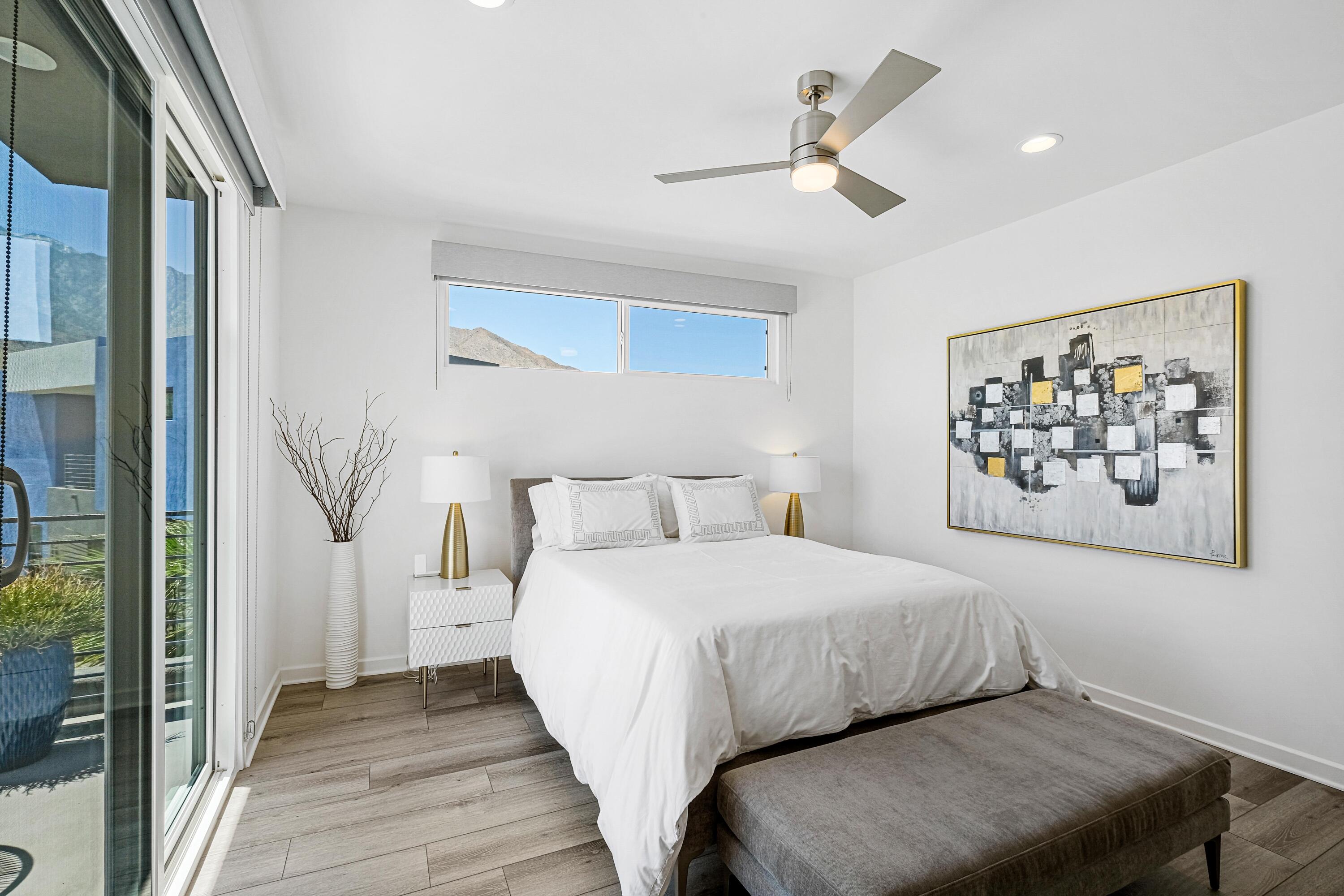 489 Beacon Way Palm Springs, CA 92262 - Photo 27 of 35 a bedroom with a bed and a painting on the wall