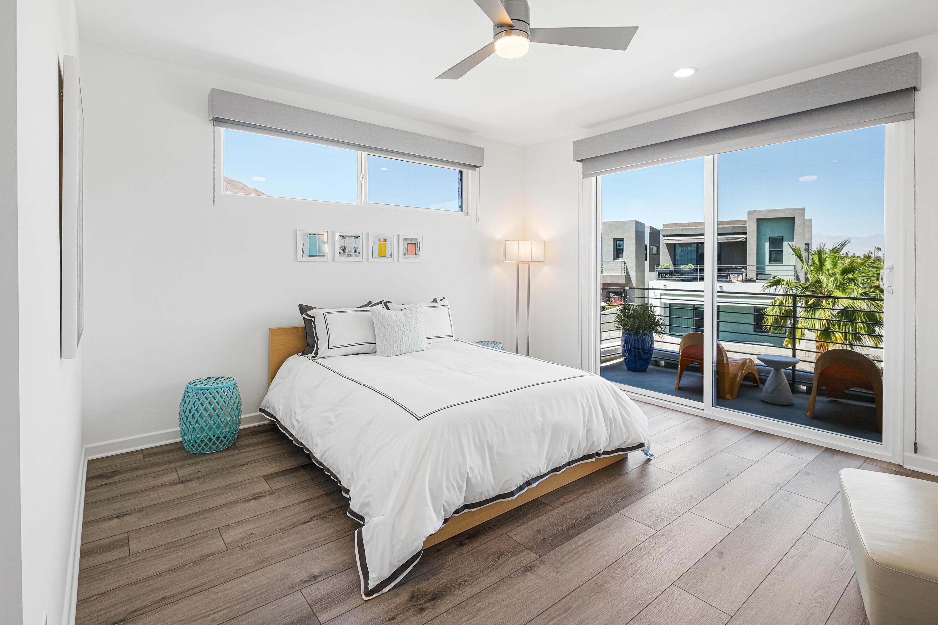 489 Beacon Way Palm Springs, CA 92262 - Photo 29 of 35 a bedroom with a large bed and a large window