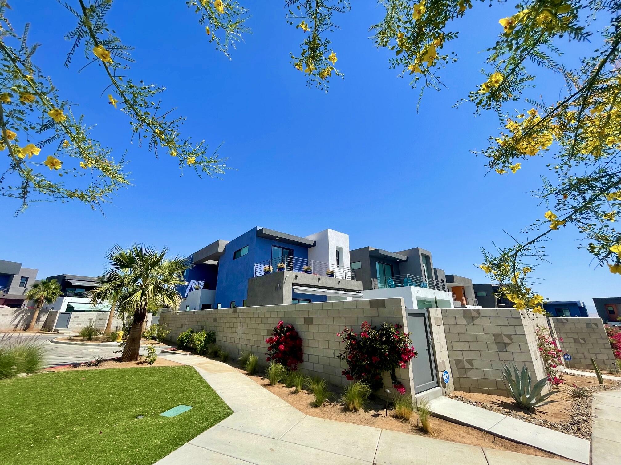 489 Beacon Way Palm Springs, CA 92262 - Photo 3 of 35 a front view of a house with a yard
