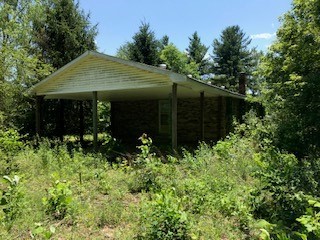 7471 Deer Ridge Road Primm Springs, TN 38476 - Photo 3 of 11 a view of a house with potted plants