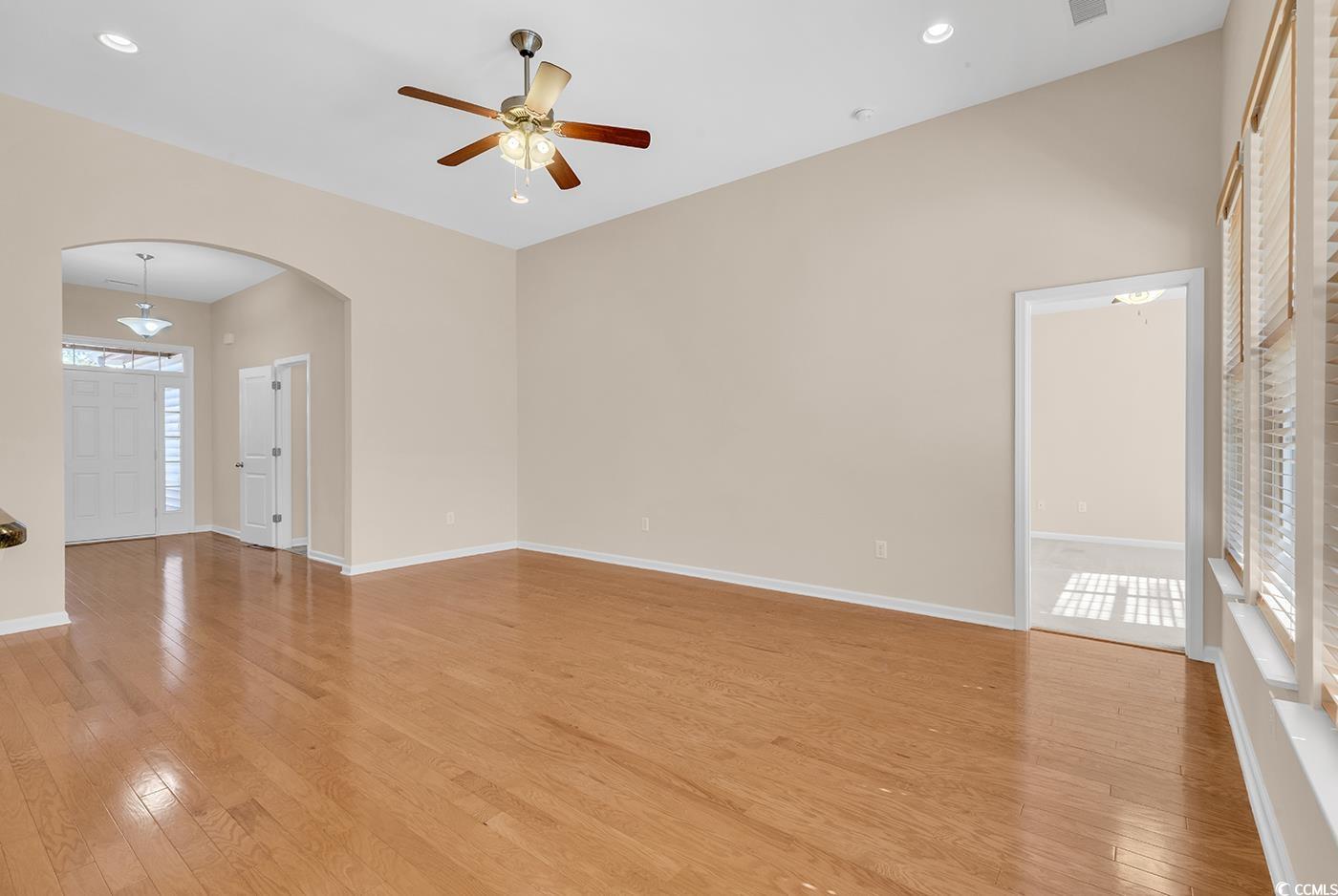 1612 Fairforest Court Conway, SC 29526 - Photo 18 of 40 Spare room featuring light wood finished floors, arched walkways, a ceiling fan, and recessed lighting