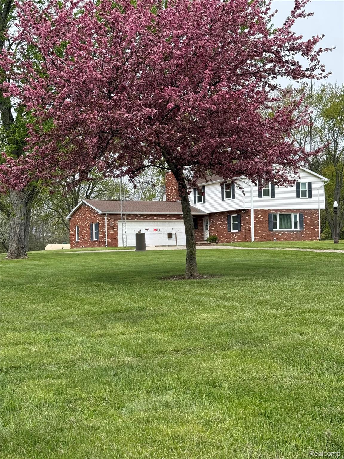 1412 South Byron Road Lennon, MI 48449 - Photo 17 of 22 front yard with flowering tree.jpeg