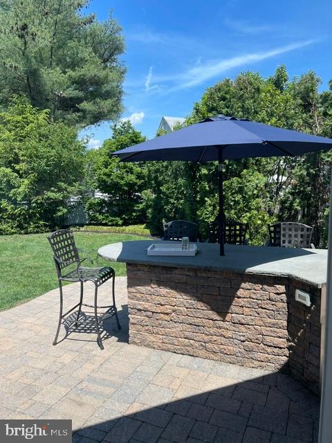 235 Hopkins Road Haddonfield, NJ 08033 - Photo 41 of 47 a view of a chairs and table in the patio