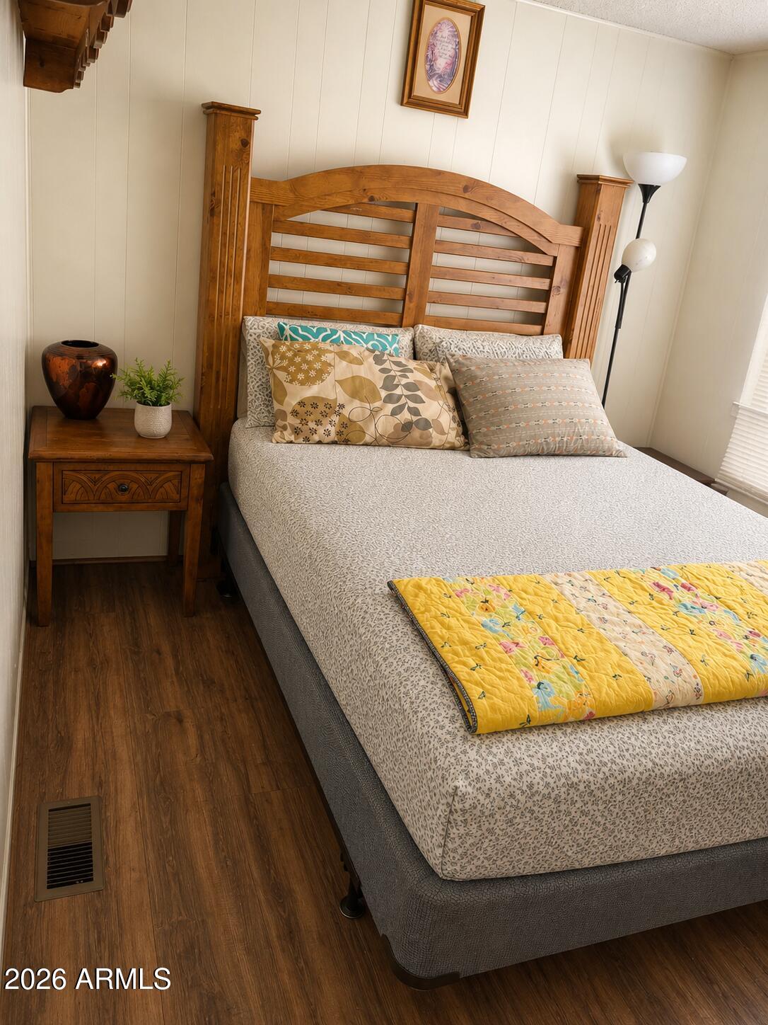 3330 East Main Street, Unit 332 Mesa, AZ 85213 - Photo 6 of 12 a bed sitting in a bedroom next to a window